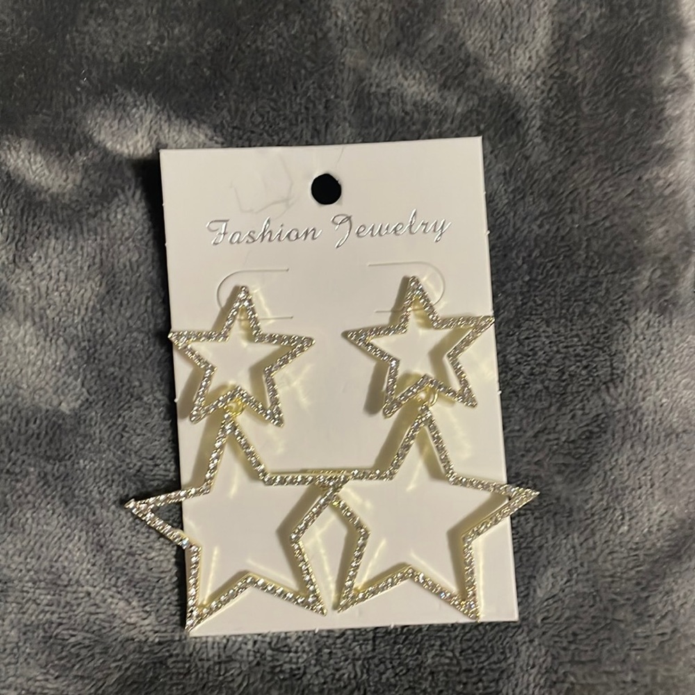 Brand new gold star earrings